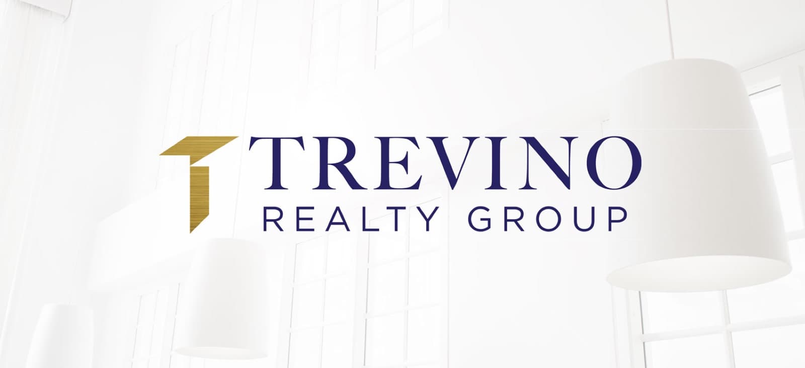 Trevino Realty logo displayed in a bright interior