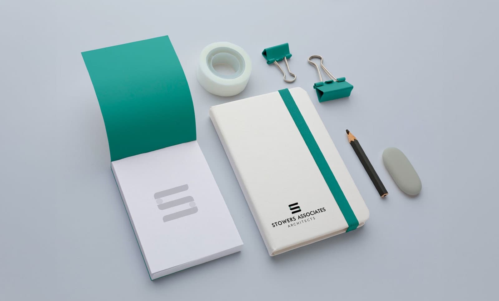 Stowers Associates branded stationery and notebook mockup