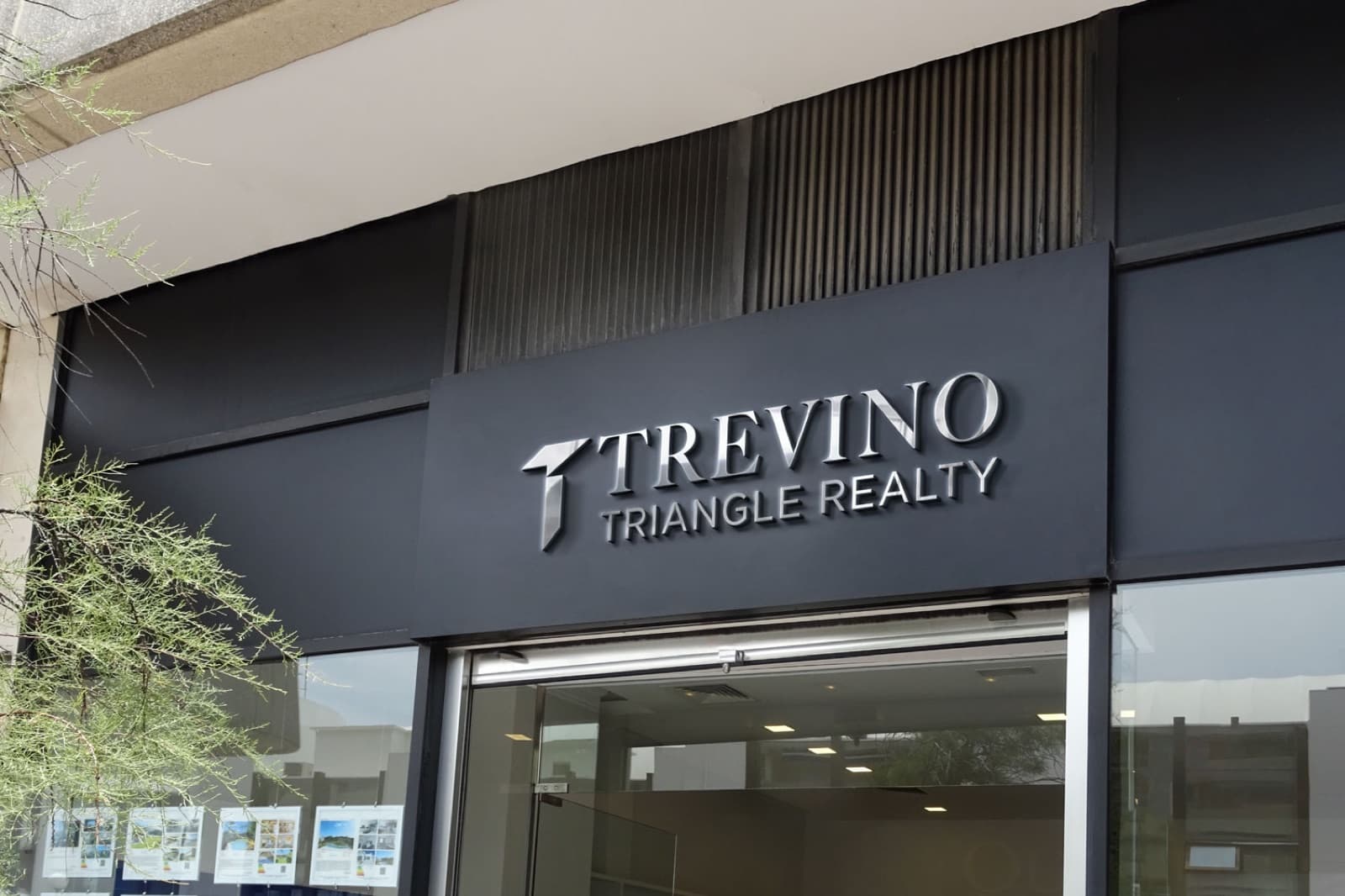 Trevino Realty chrome office signage