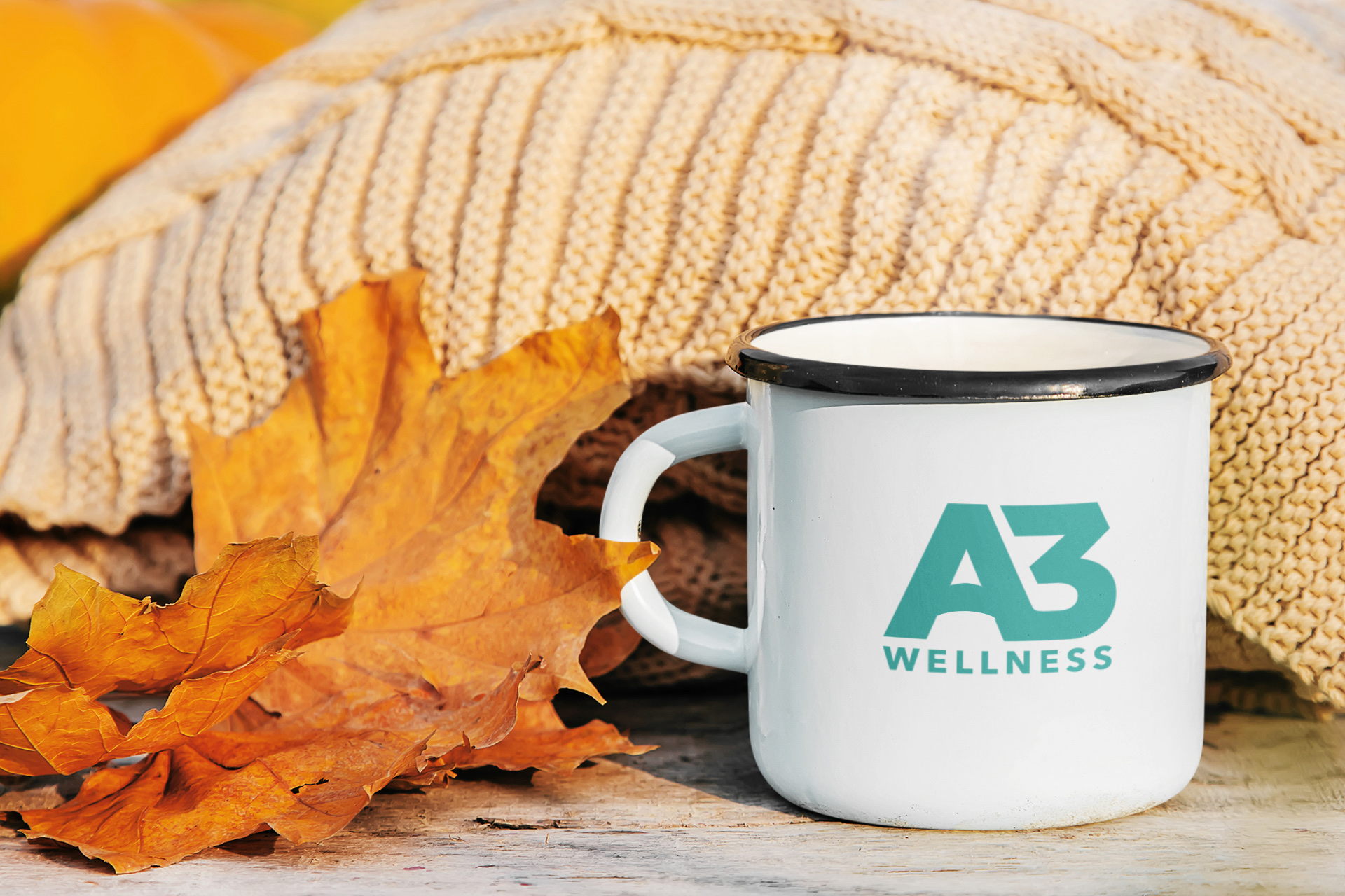 A3 Wellness logo on an enamel mug in a warm lifestyle setting