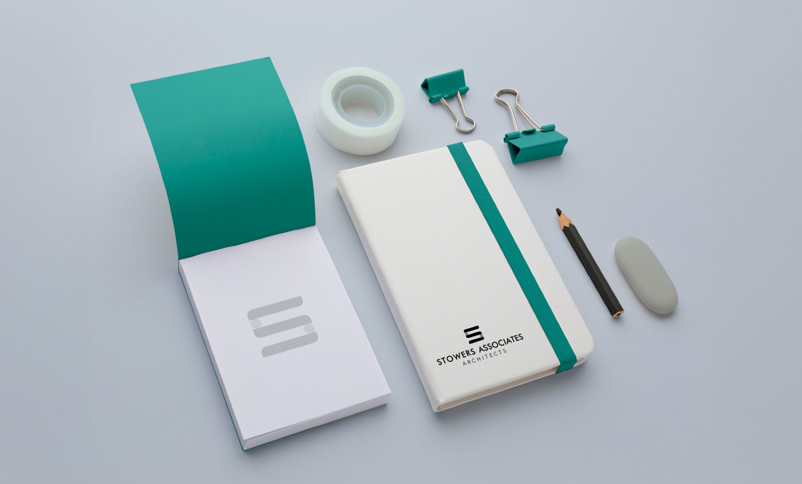 Stowers Associates branded stationery and notebook mockup